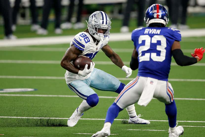 Cowboys wide receiver CeeDee Lamb (88) puts on the brakes to avoid Giants defensive back...