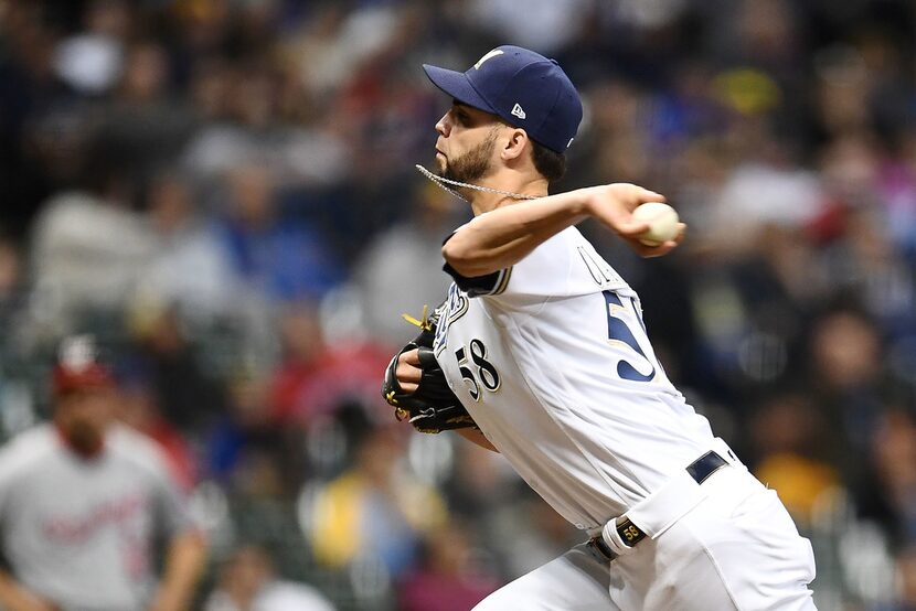 MILWAUKEE, WISCONSIN - MAY 06:  Alex Claudio #58 of the Milwaukee Brewers throws a pitch...