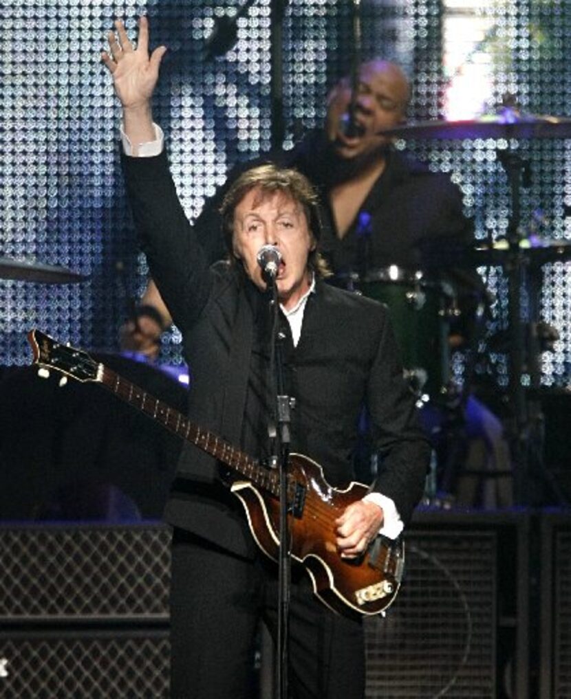 Former Beatle Paul McCartney acknowledges the crowd during his performance at the new Dallas...