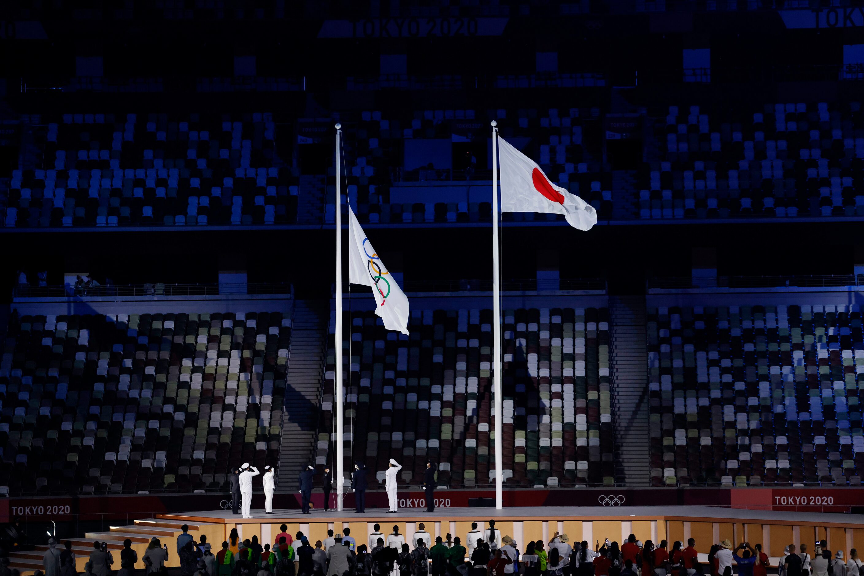 The Olympic flag is raised during opening ceremony for the postponed 2020 Tokyo Olympics at...