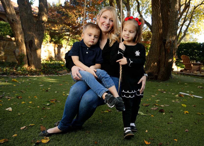 Amber Freed, with her 4-year-old twins, Maxwell and Riley, at their Frisco home.