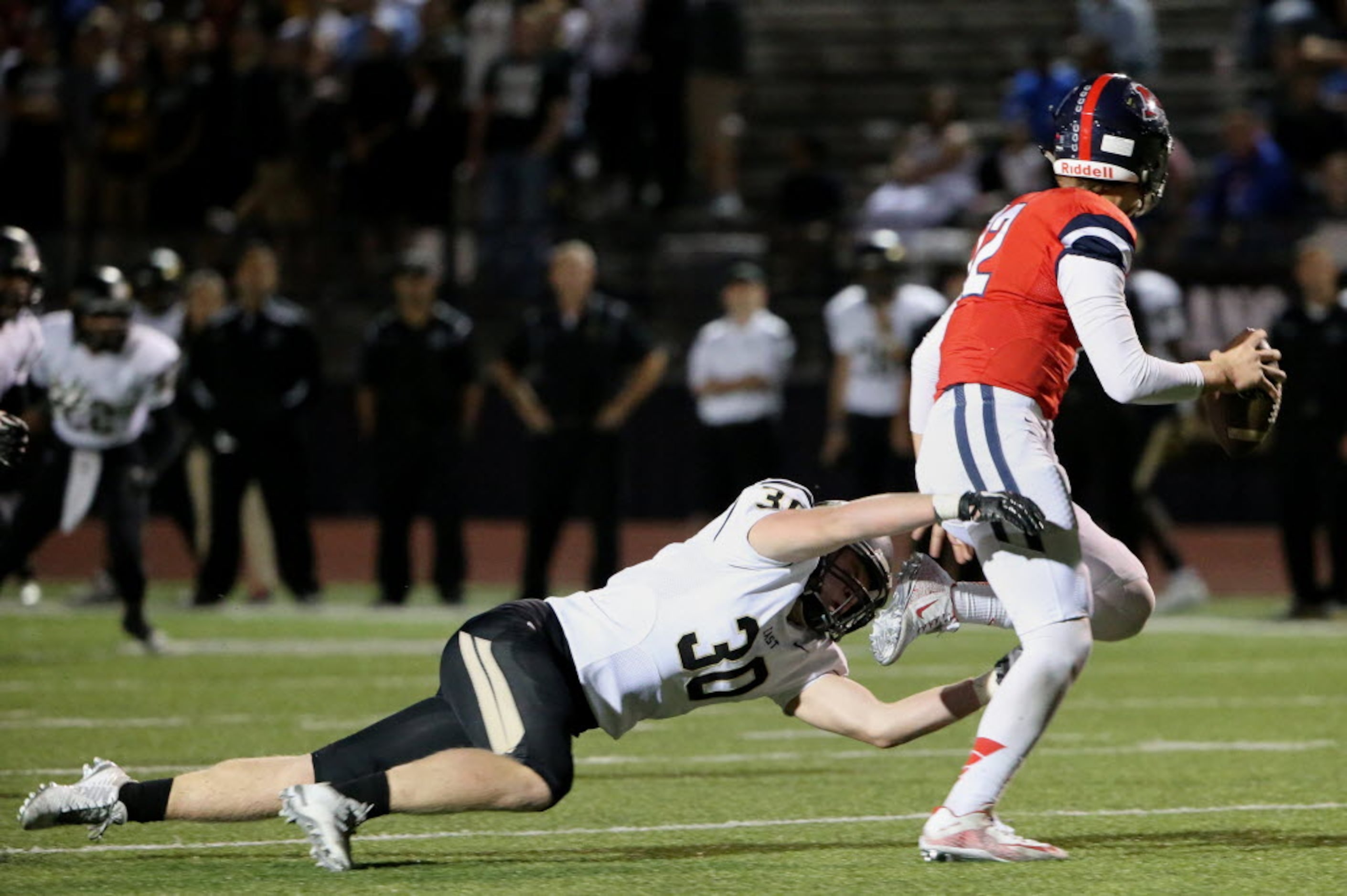 Plano East defensive lineman Grayson Diepenbrock (30) sacks McKinney Boyd quarterback Grant...