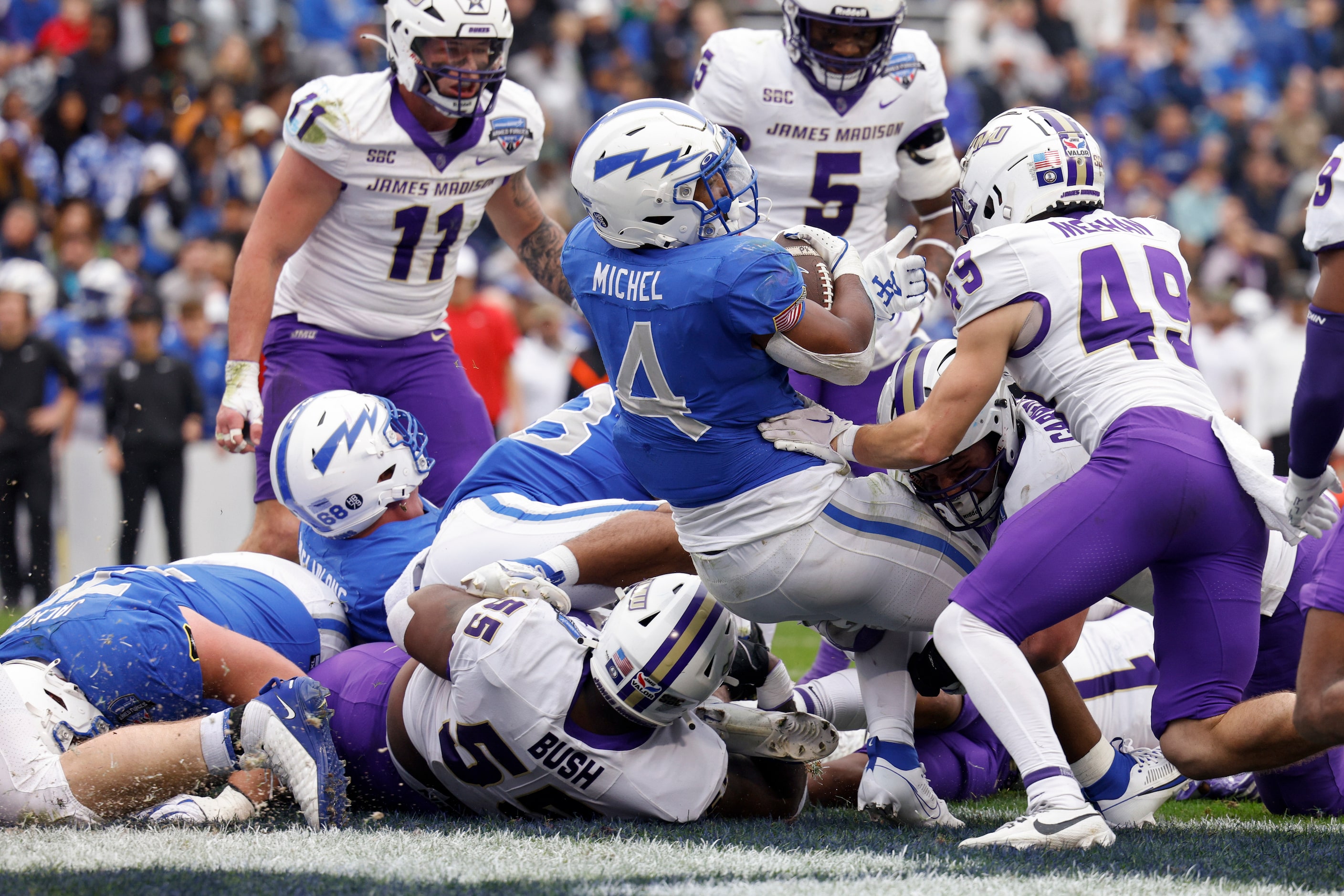 Air Force Falcons fullback Emmanuel Michel (4) falls into the end zone for a rushing...