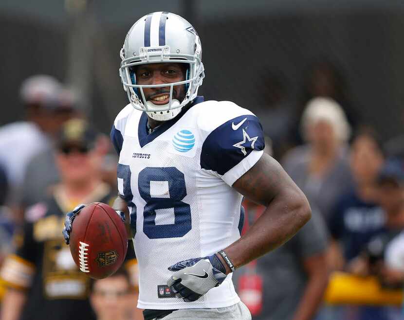 Dallas Cowboys wide receiver Dez Bryant (88) reacts after making a catch along the sideline...