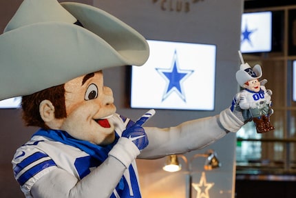 Dallas Cowboys mascot Rowdy shows off the new Rowdy souvenir cup that will be sold at AT&T...