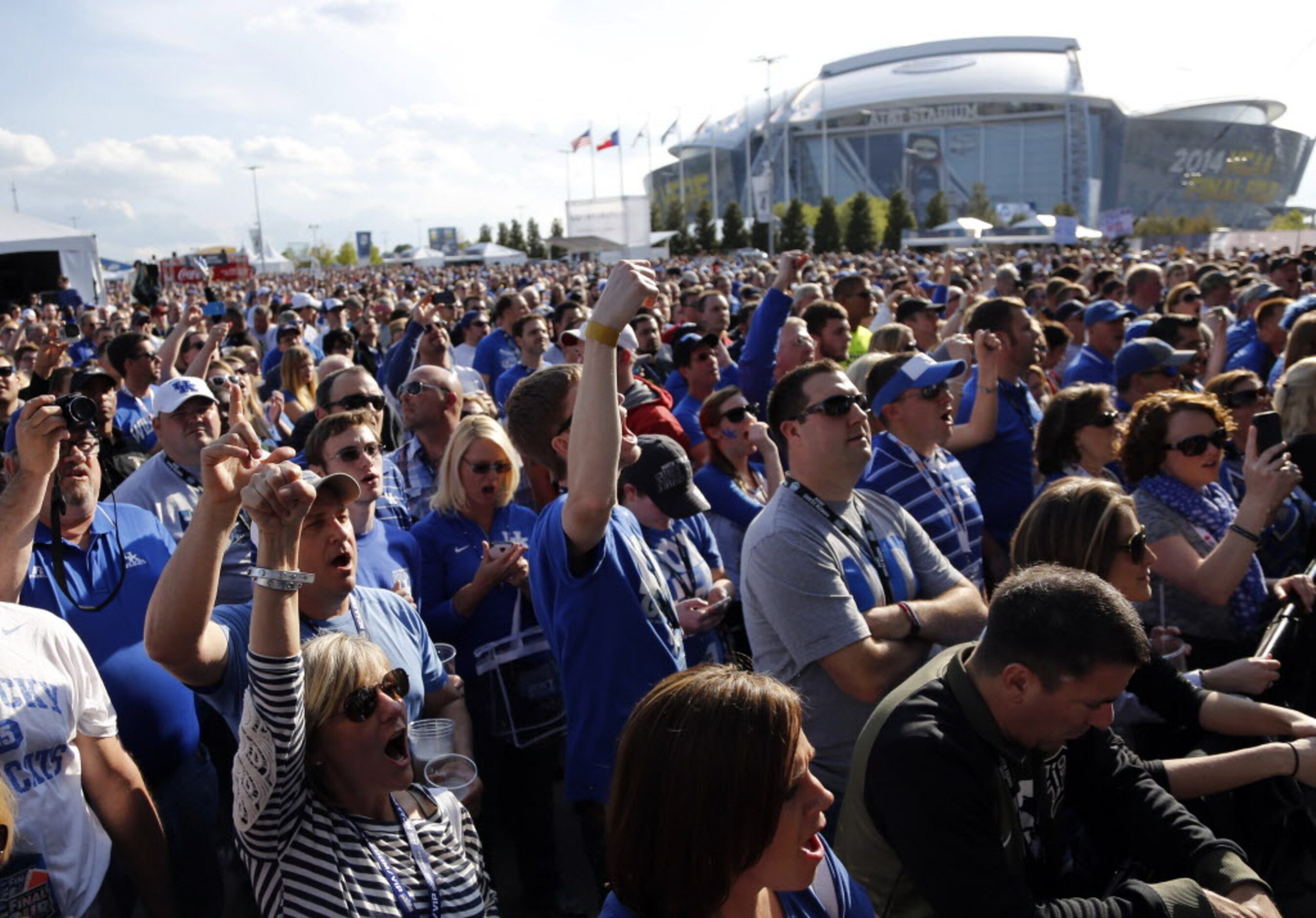 Kentucky Wildcats fans cheer as the band plays during the Tip-Off Tailgate party before the...