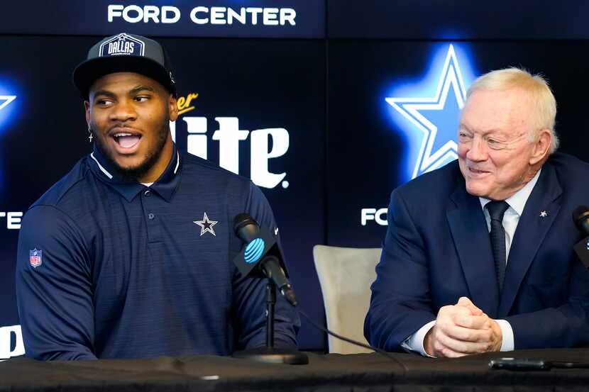 Dallas Cowboys first-round draft pick Micah Parsons (left) laughs with team owner Jerry...