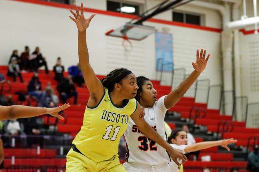 DeSoto’s Tionna Herron (11) calls for the ball over Sachse’s Micah Cooper (32) during a game...