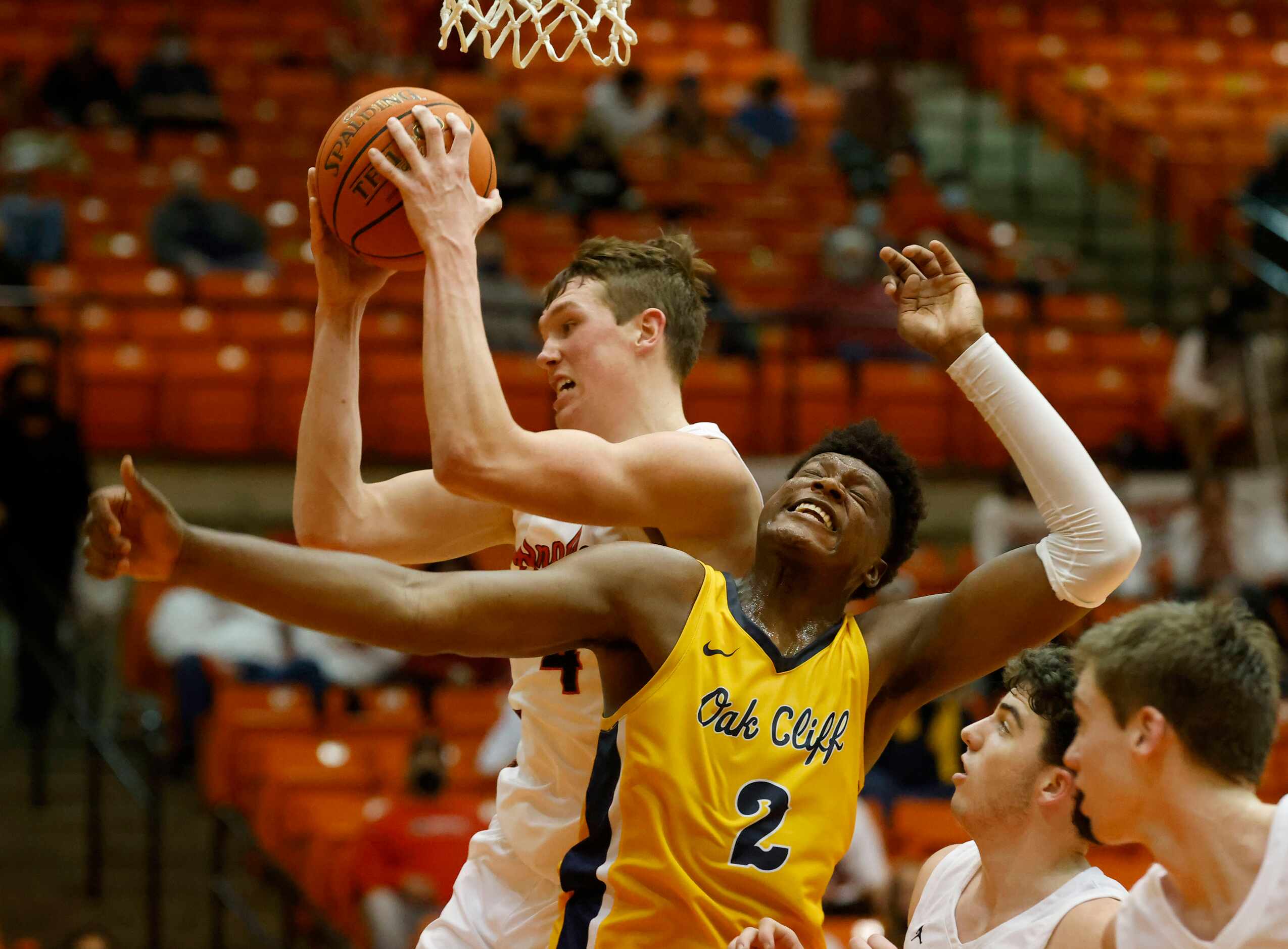 Argyle’s Nate Atwood (4) grabs a rebound in front of Oak Cliff Faith Family’s Brandon Walker...