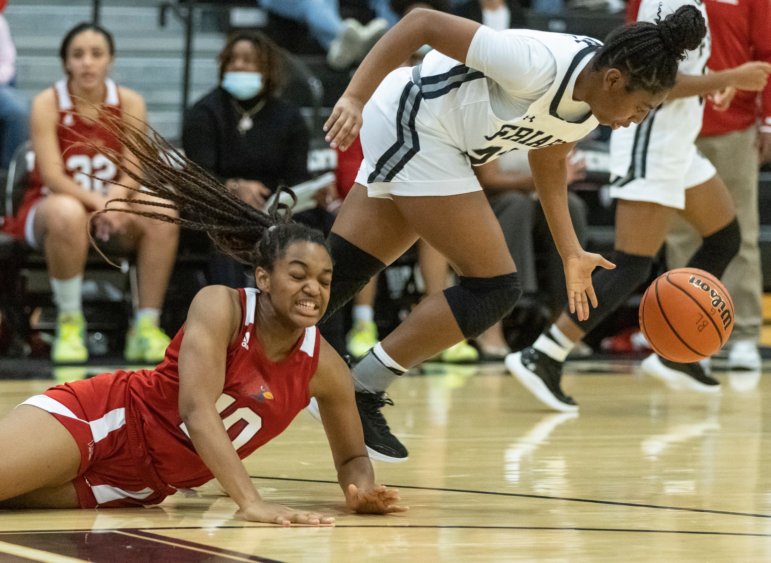 John Paul II High School Destiny Jones (10) dives to grab the loose ball as Bishop Lynch...