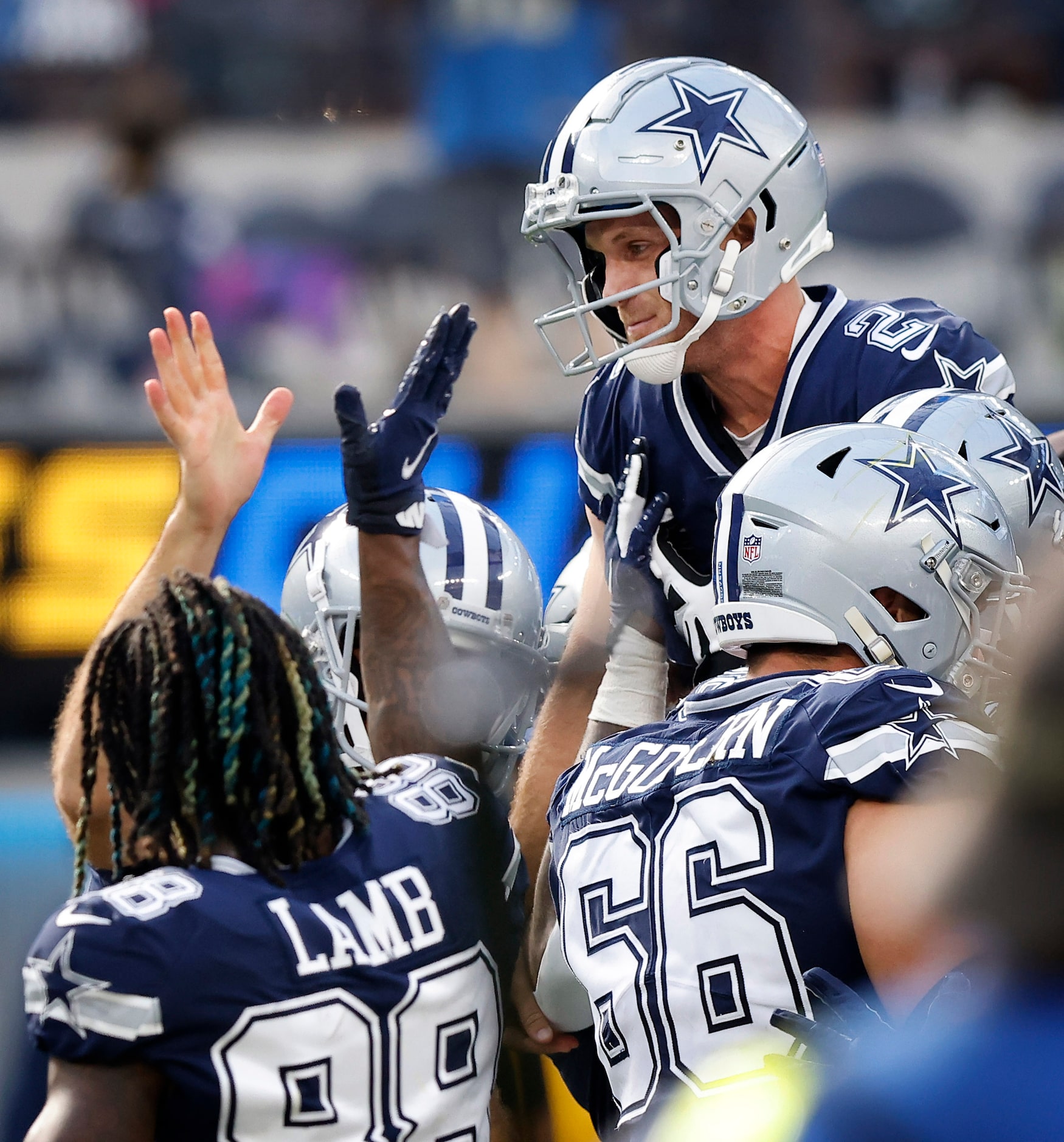 Dallas Cowboys place kicker Greg Zuerlein (2) lifted into the air and congratulated by...