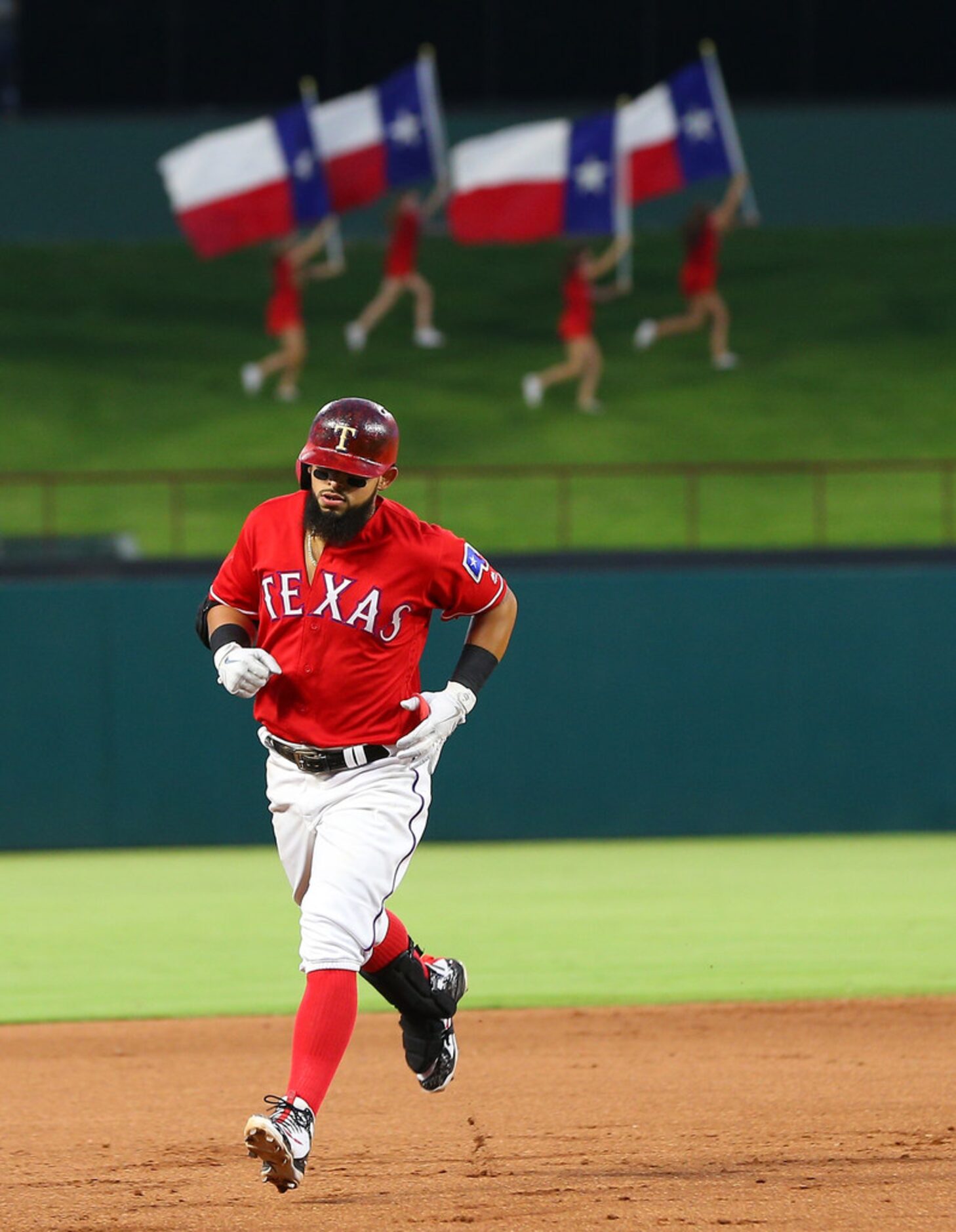 ARLINGTON, TX - AUGUST 03: Rougned Odor #12 of the Texas Rangers runs the bases in the...