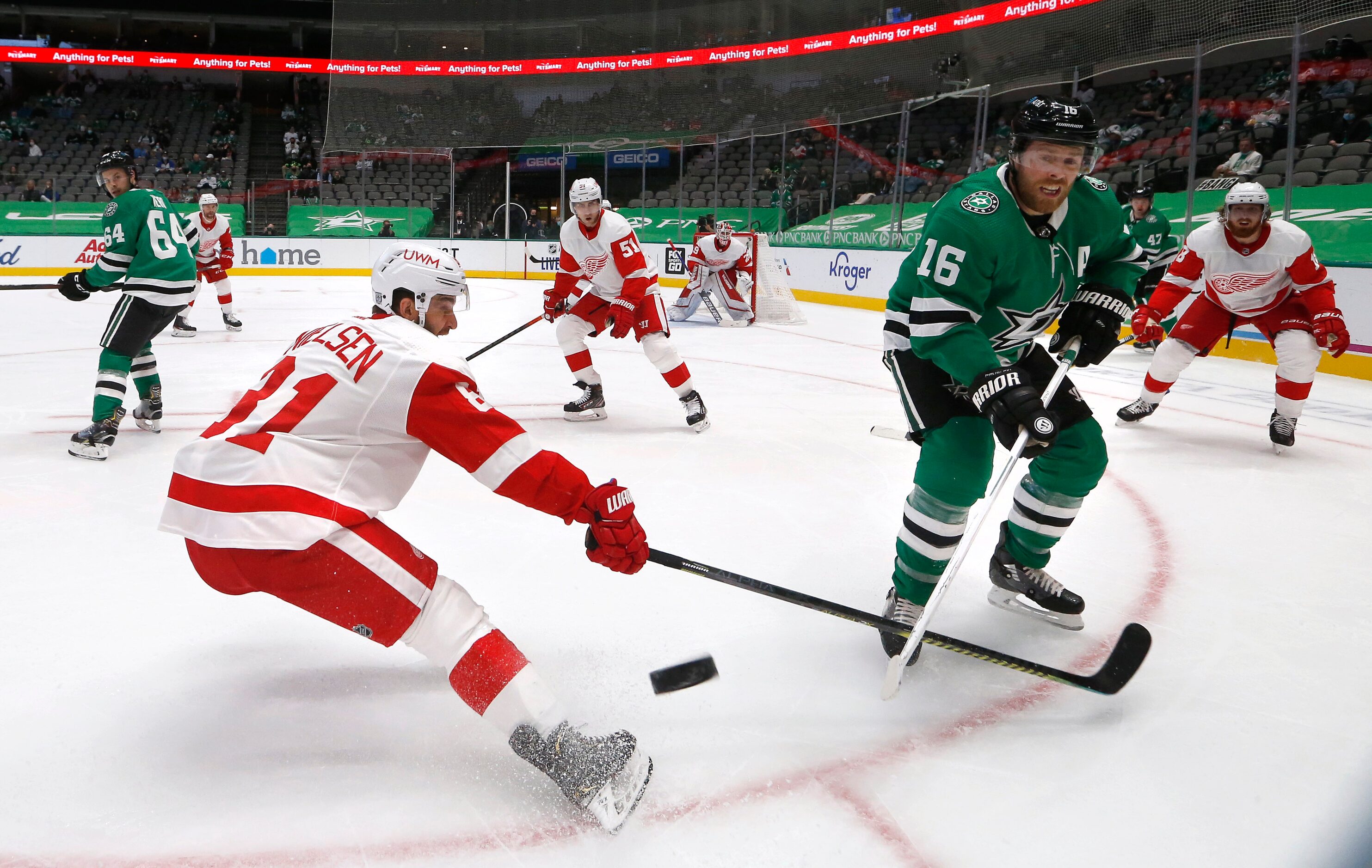 Dallas Stars center Joe Pavelski (16) passes the puck as Detroit Red Wings center Frans...