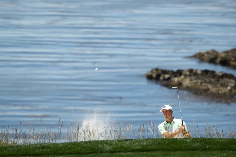PEBBLE BEACH, CALIFORNIA - JUNE 10: Jordan Spieth of the United States plays a shot from a...
