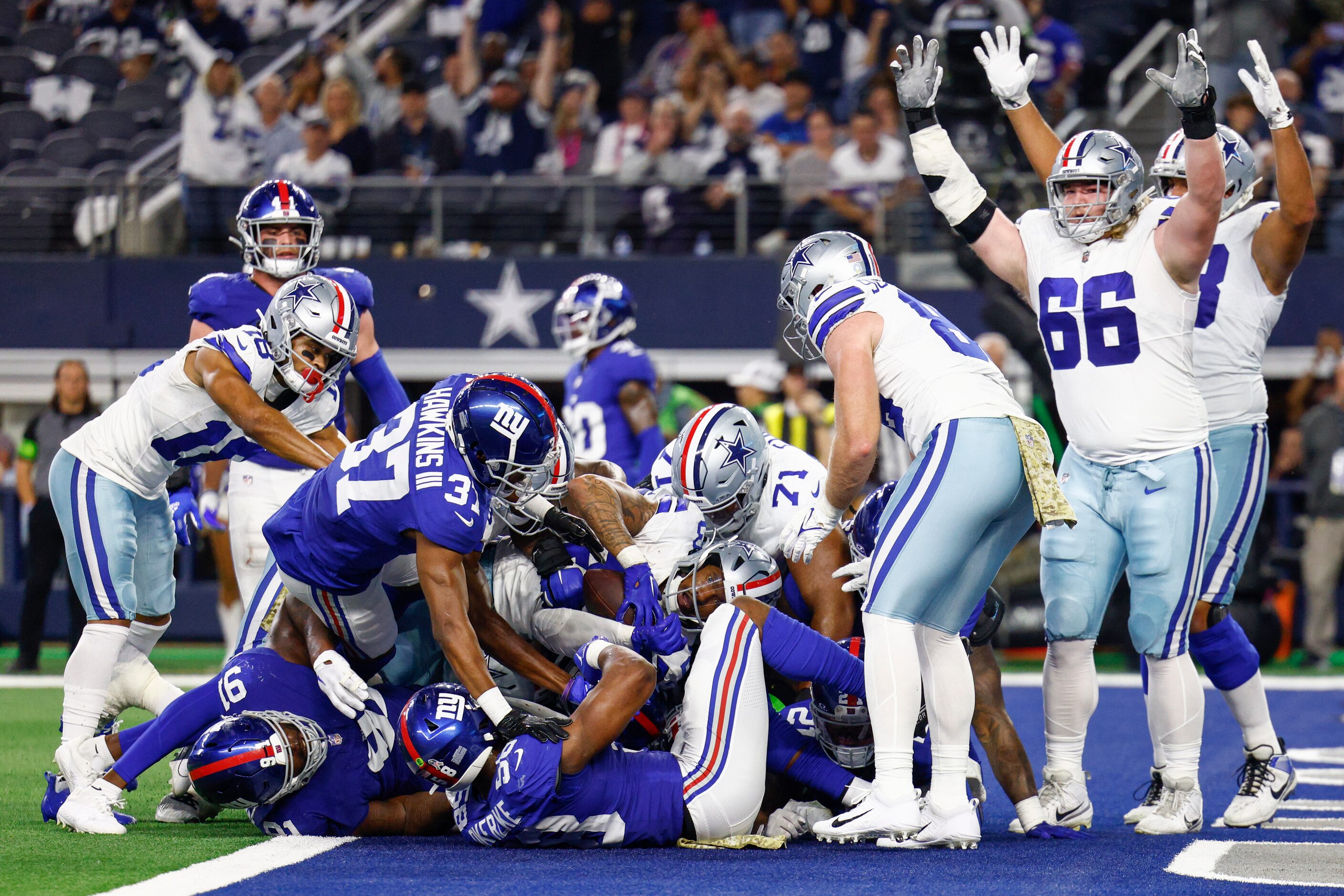 Dallas Cowboys running back Rico Dowdle (23) rushes for a touchdown as guard T.J. Bass (66)...