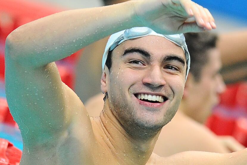 Tongan swimmer Amini Fonua gestures during a semi-final for the Men's 50 metre breaststroke...