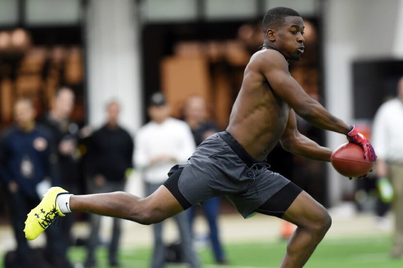 Colorado defensive back Chidobe Awuzie goes through coverage drills for NFL football scouts...