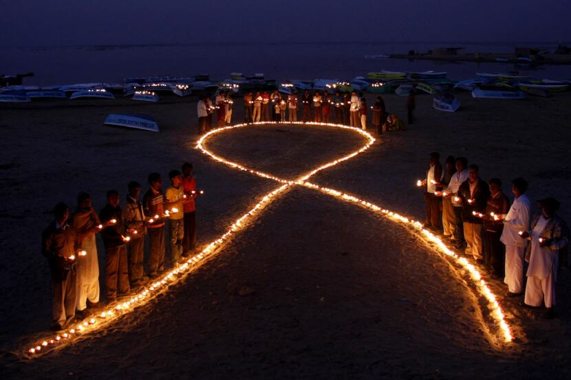  A file picture taken on November 30, 2009 shows Indian villagers holding oil lamps as they...