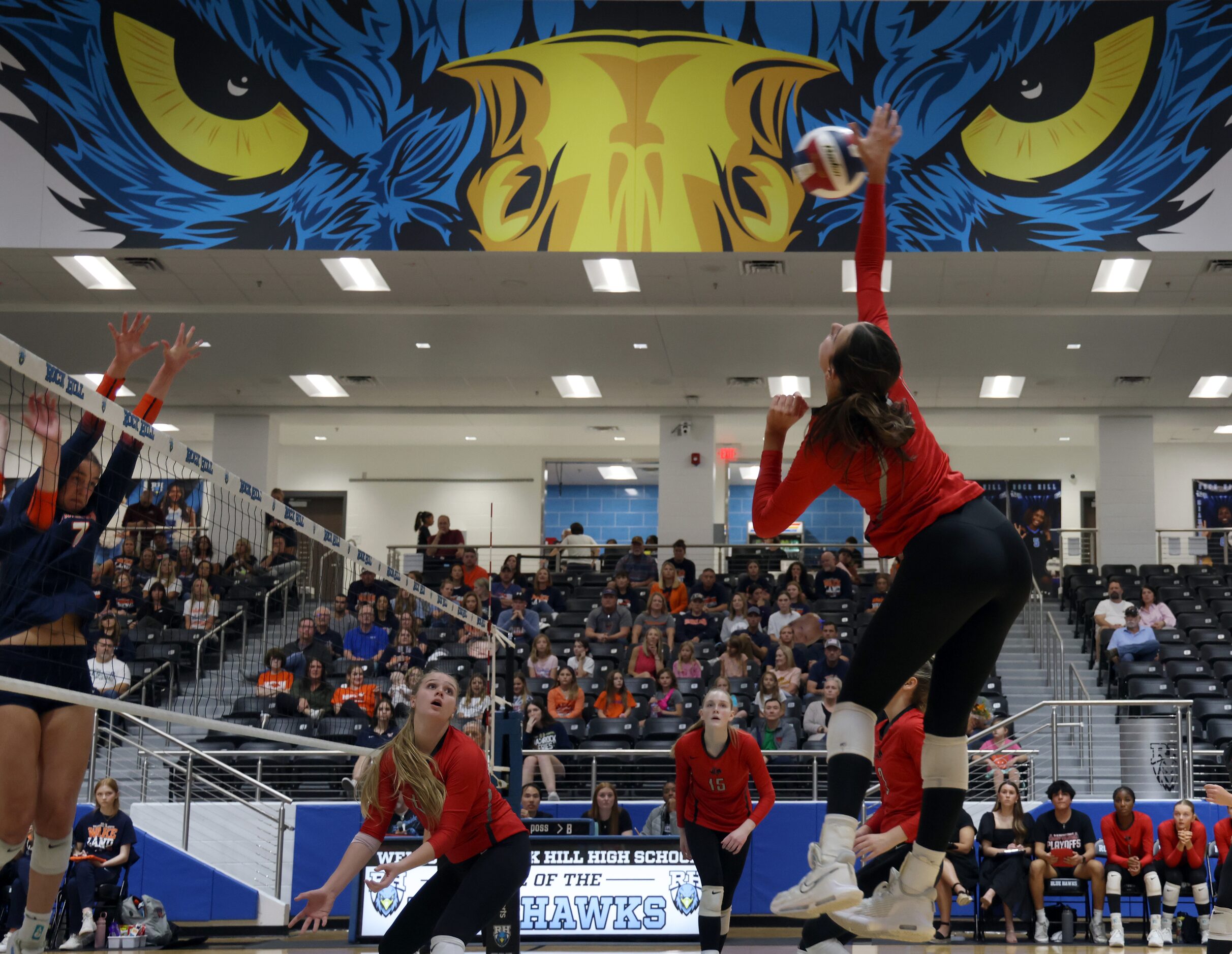 Frisco Liberty's MJ McCurdy (7), right, skies to spike against Frisco Wakeland's Jessica...