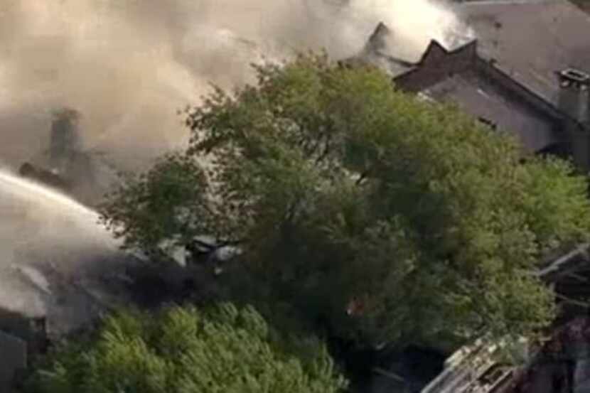 Smoke billows from a two-story apartment complex that burned Thursday morning in Irving.