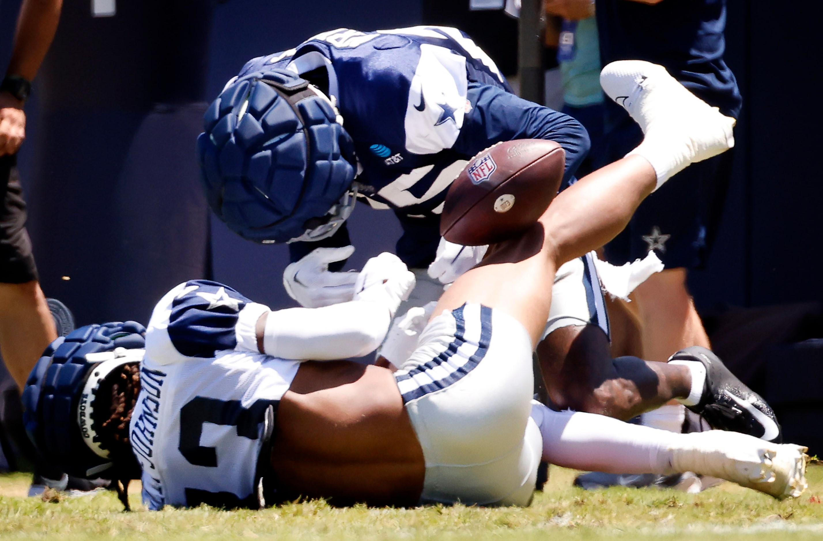 Dallas Cowboys cornerback Nahshon Wright (25) strips the ball from wide receiver Tyron...