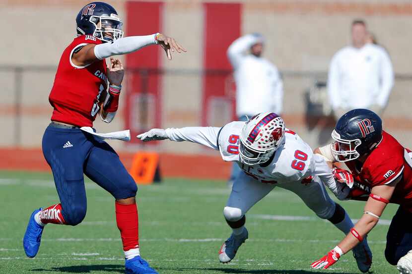 Plano John Paul II's Grayson James (3) attempts a pass as Parish Episcopal's Josue Munoz...