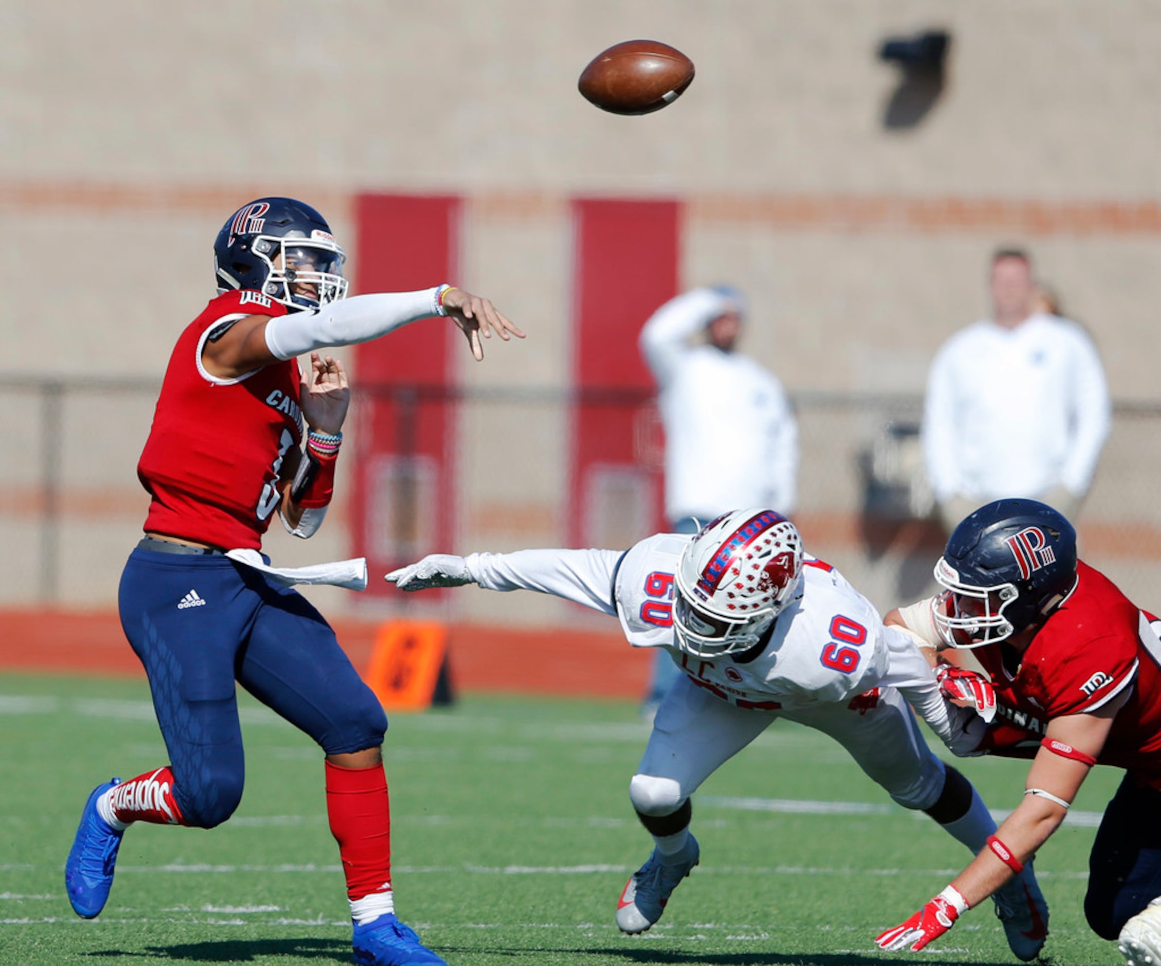 Plano John Paul II's Grayson James (3) attempts a pass as Parish Episcopal's Josue Munoz...