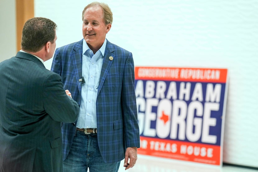 Texas Attorney General Ken Paxton talks with Texas Court of Criminal Appeals candidate Lee...