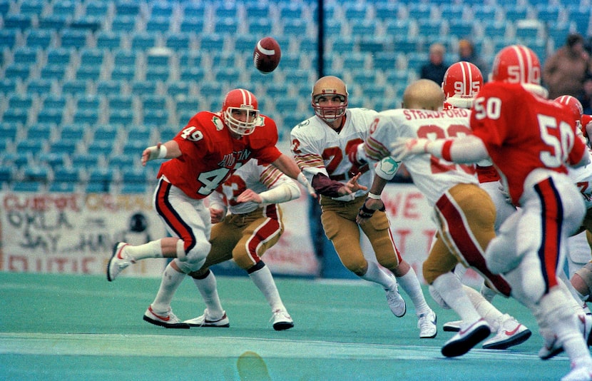 Quarterback Doug Flutie (22) of Boston College launches a pass during first quarter action...