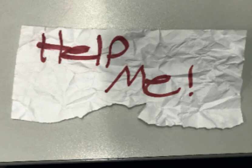 The 13-year-old girl wrote “Help me!” on a piece of paper and caught the attention of a...