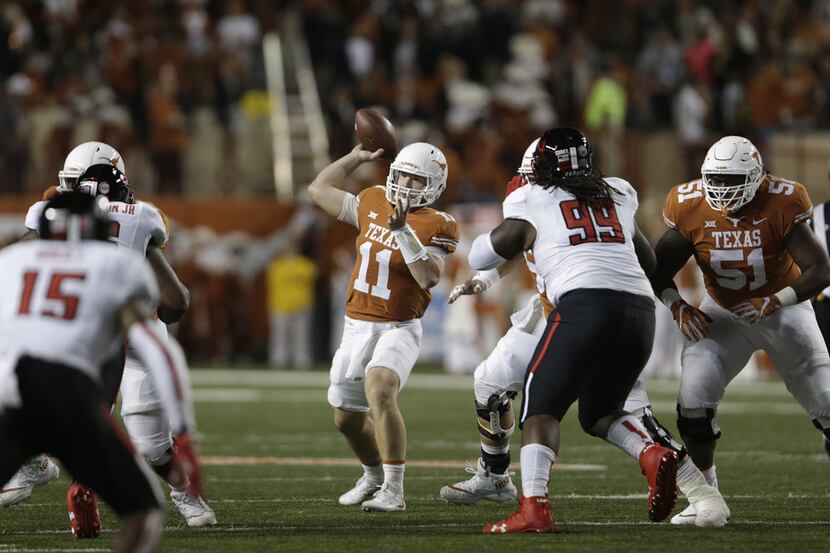 AUSTIN, TX - NOVEMBER 24:  Sam Ehlinger #11 of the Texas Longhorns throws a pass in the...