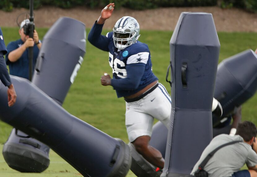 Dallas Cowboys defensive tackle Maliek Collins (96) makes his way through the obstacles...