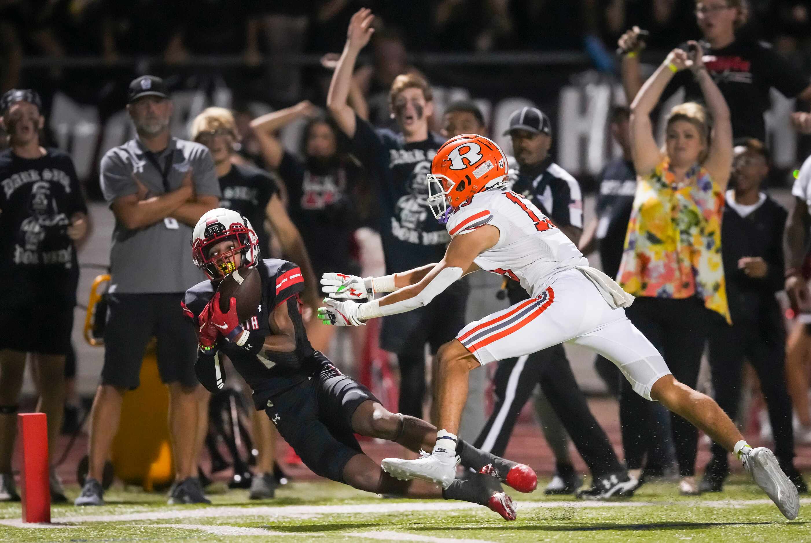 Rockwall-Heath wide receiver Jay Fair (1) can’t make a diving catch at the goal line as...