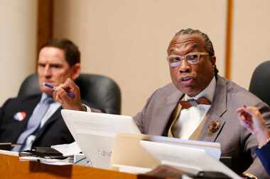 Dallas County Commissioner John Wiley Price (center) with County Judge Clay Jenkins and...