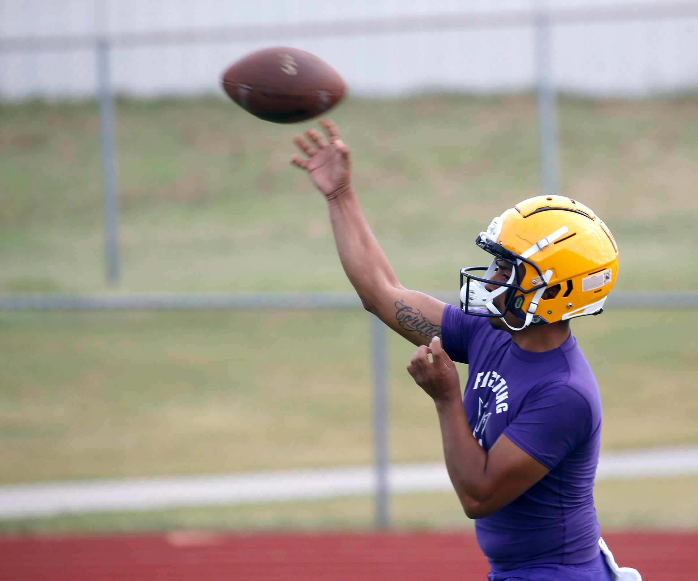 Farmersville's quarterback EJ Chairez throws the ball during the first day of high school...