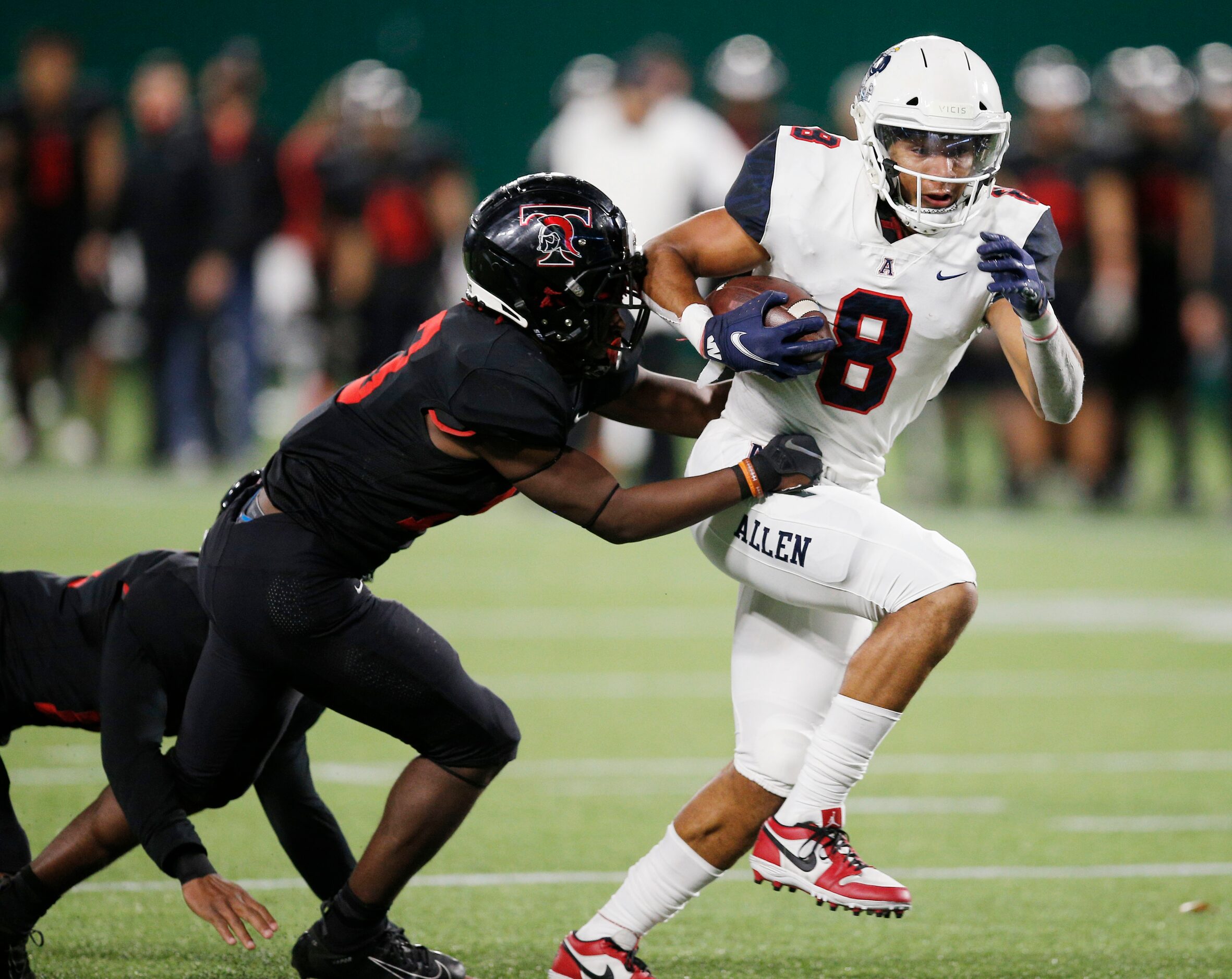 Allen senior wide receiver Blaine Green (8) breaks past Euless Trinity junior defensive back...