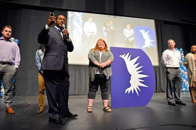 Dallas ISD trustee Lew Blackburn (left) conducts a presentation with new teachers during the...