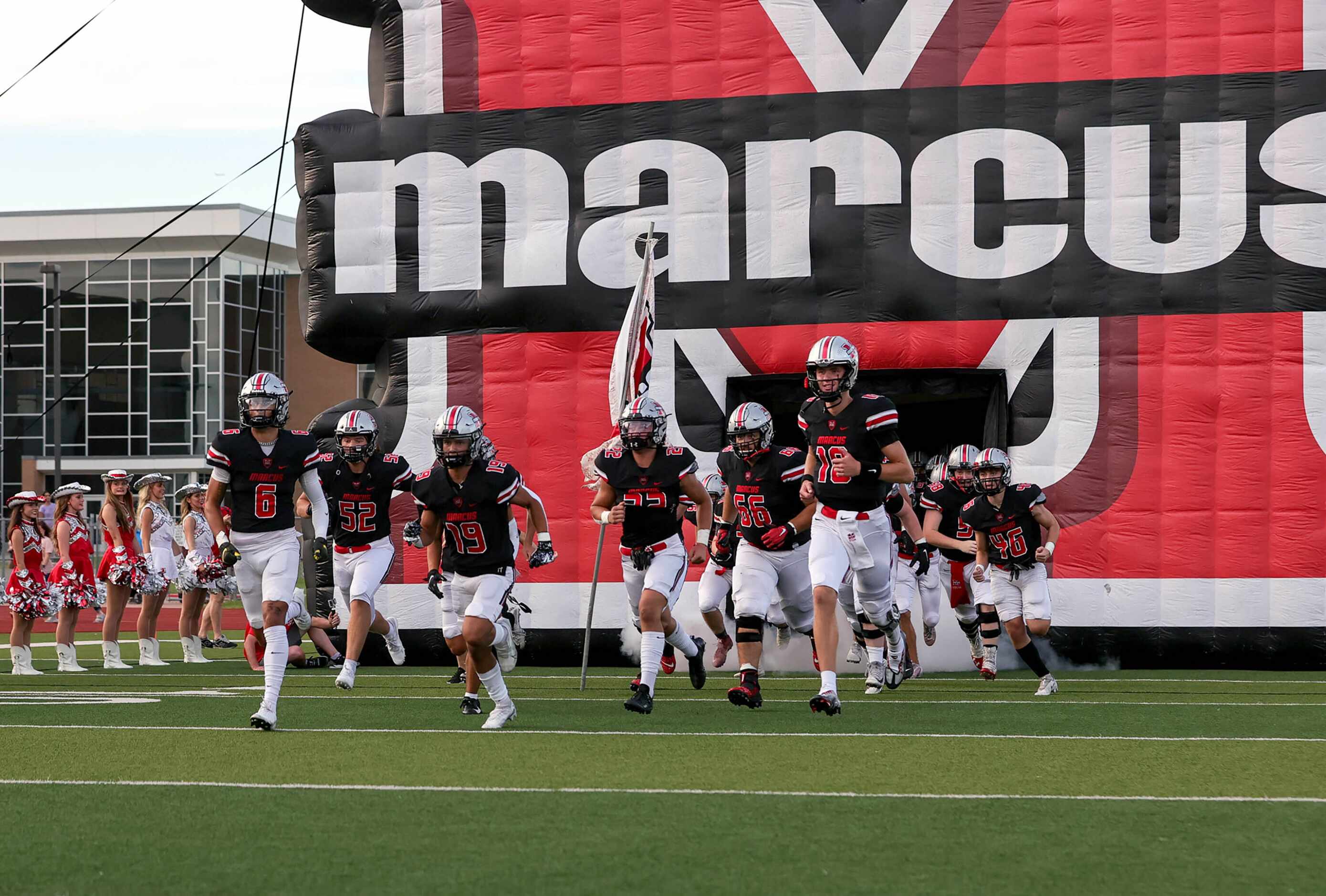 The Flower Mound Marcus Marauders enter the field to face Southlake Carroll in a high school...