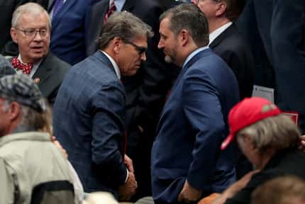 Secretary of Energy Rick Perry and Sen. Ted Cruz are seen at a Trump campaign rally at...