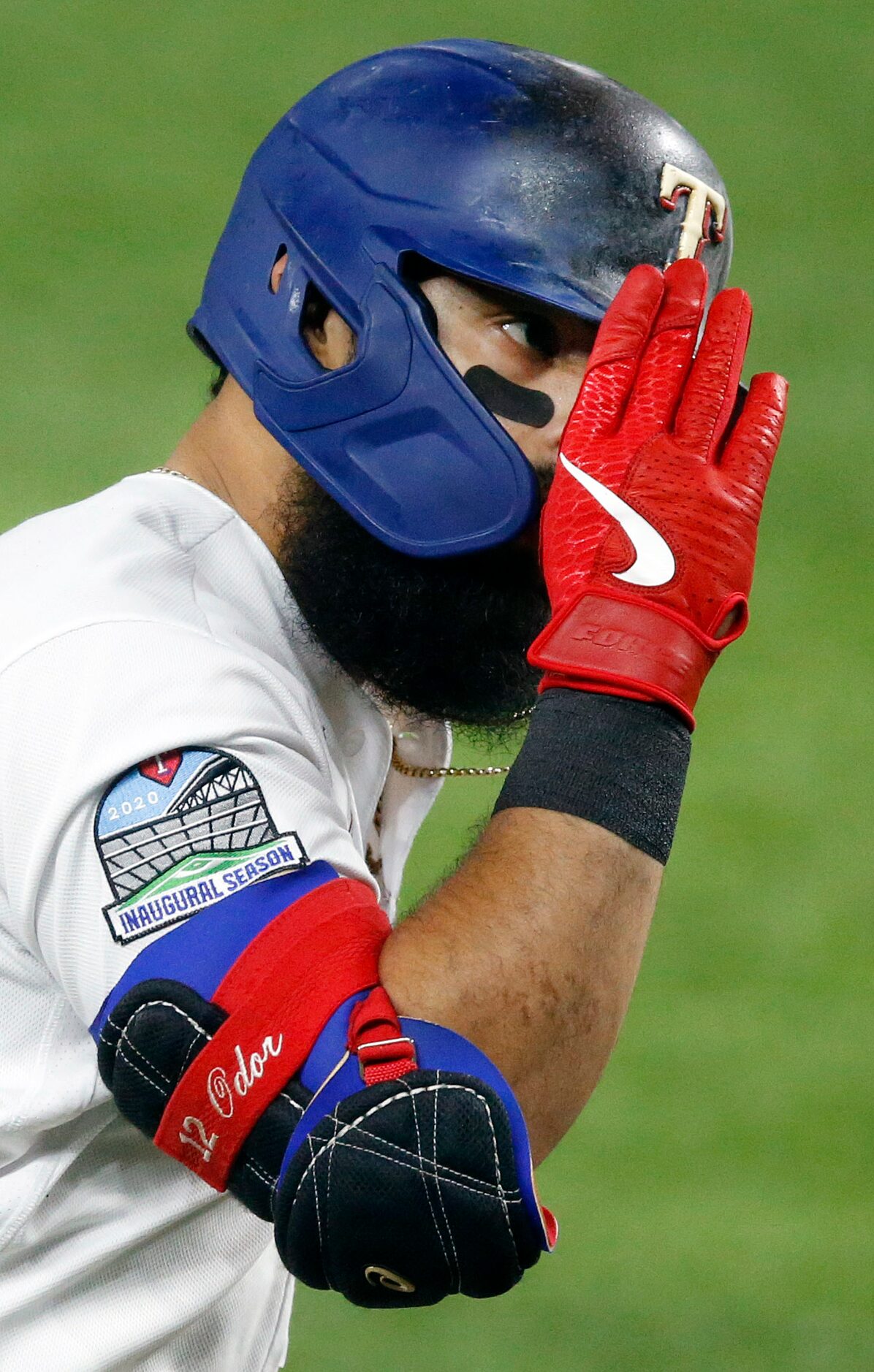 Texas Rangers second baseman Rougned Odor (12) salutes third base coach Tony Beasley (not...