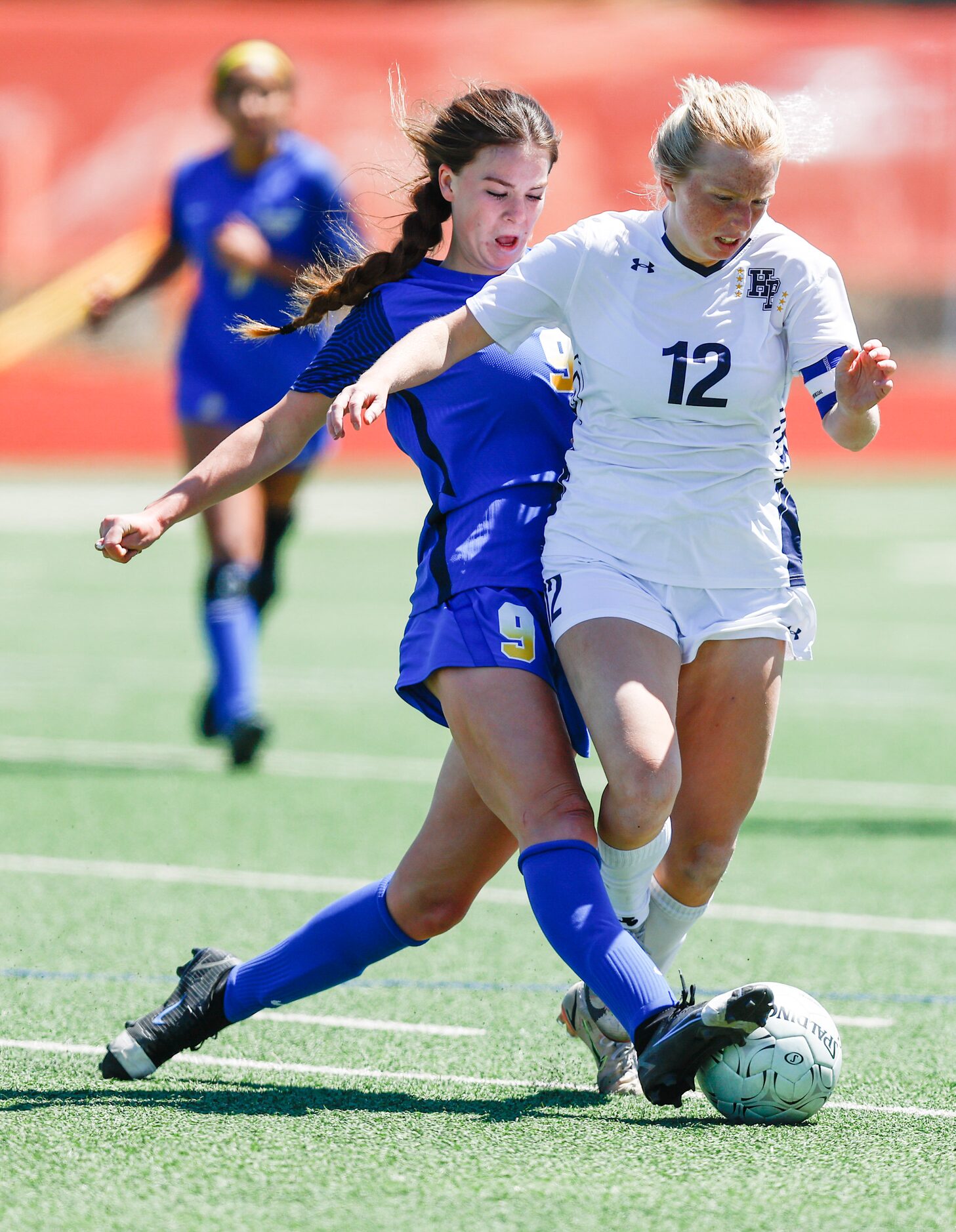 Frisco’s Kat Campbell (9) and Highland Park’s Kylie Bell (12) battle for the ball during the...