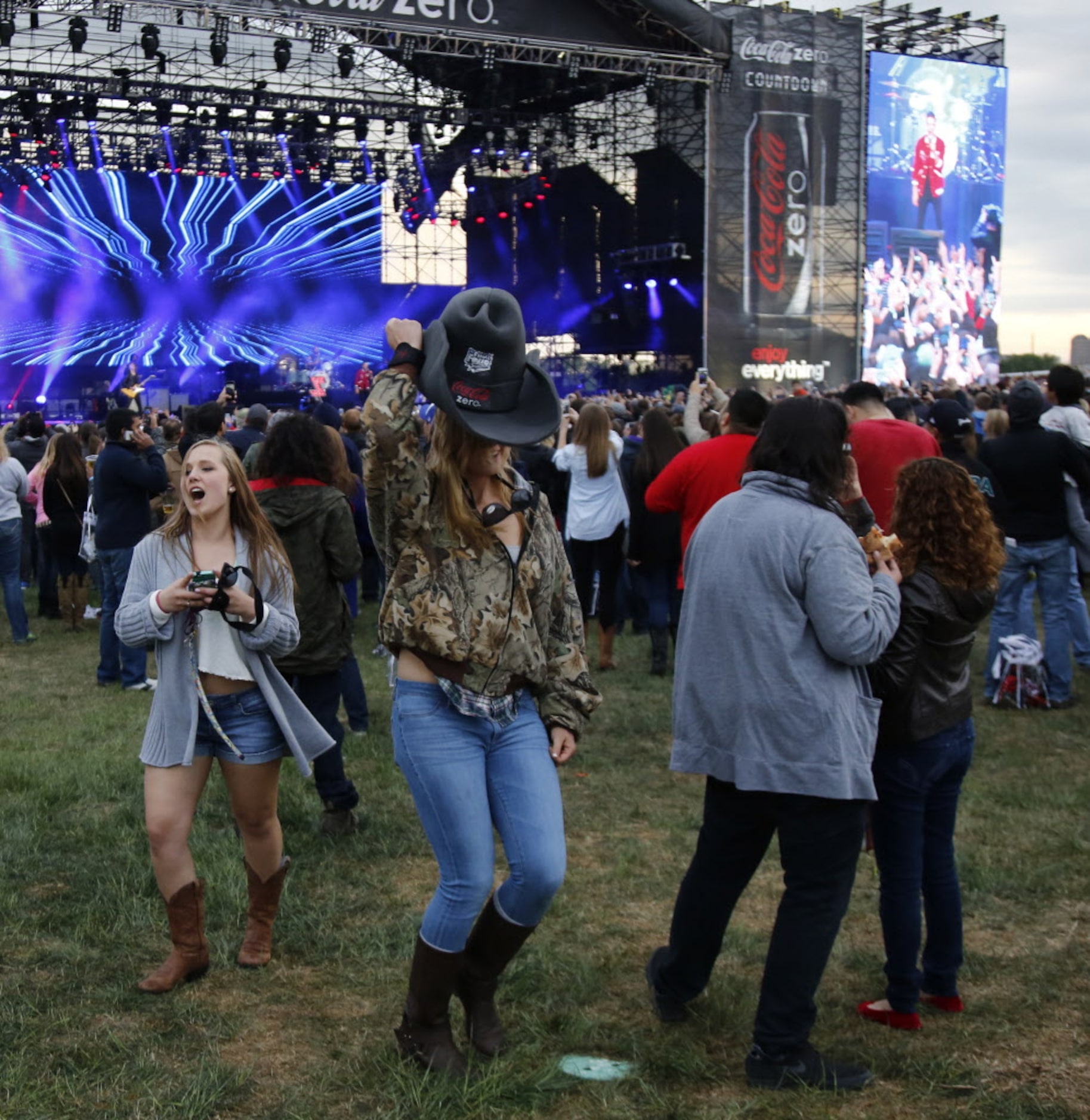 Annie Cravens (left) and Francesca Goncalves dance to The Killers during March Madness Music...