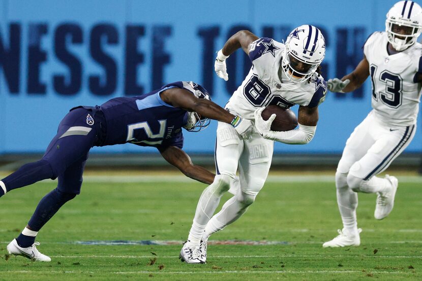 Dallas Cowboys wide receiver CeeDee Lamb (88) spins out of a tackle attempt from Tennessee...