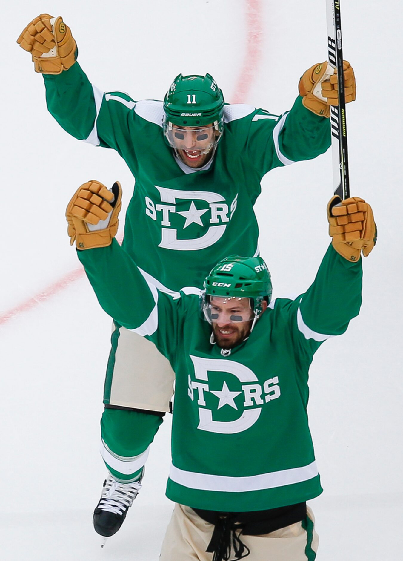 Dallas Stars left wing Blake Comeau (15) celebrates with center Andrew Cogliano (11) after...