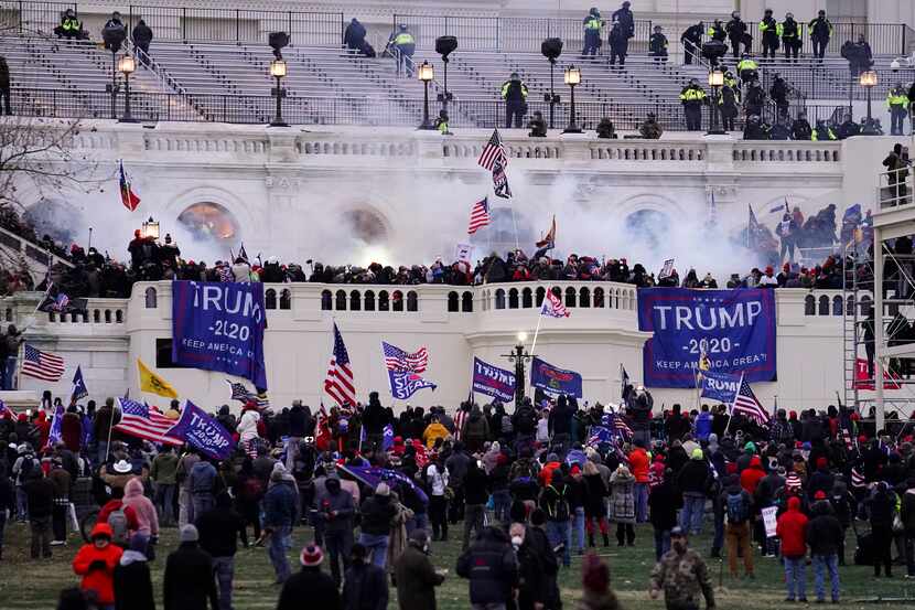 FILE - Violent insurrectionists loyal to President Donald Trump, storm the Capitol,...