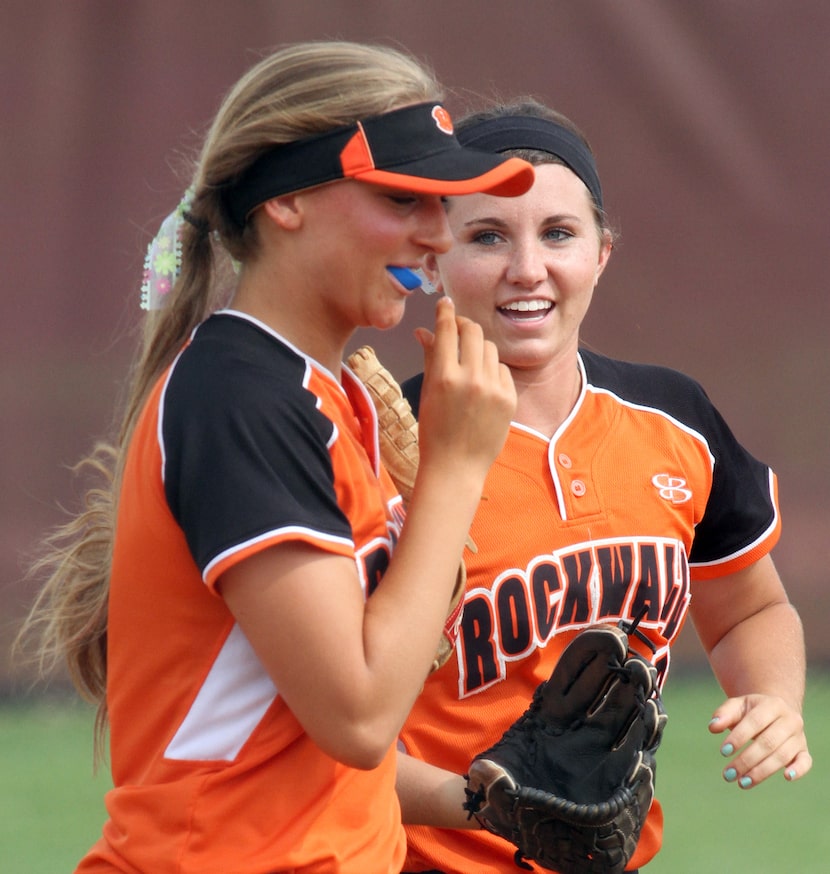 Rockwall outfielder Kindal Sauter (13), right, was all smiles as she runs alongside teammate...