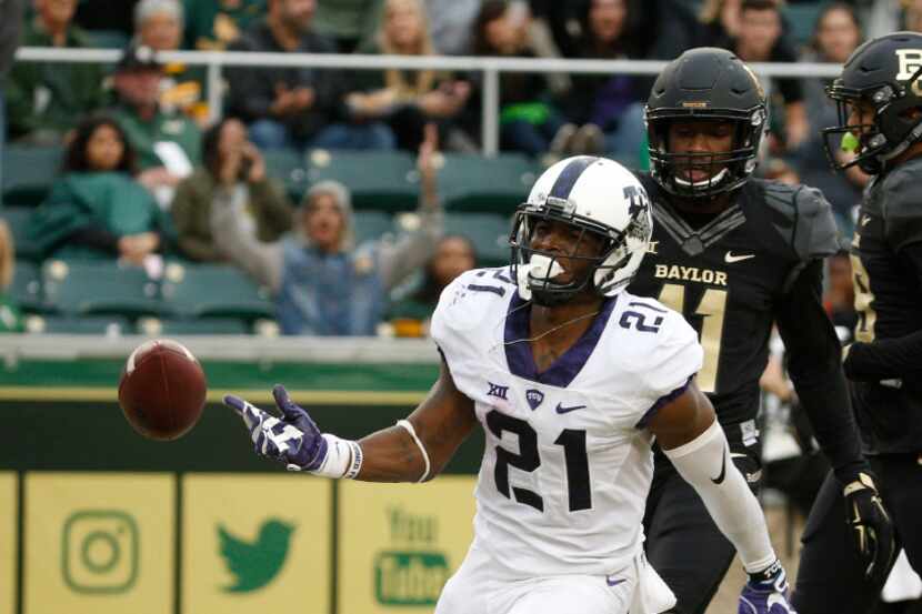 TCU Horned Frogs running back Kyle Hicks (21) runs in a touchdown against the Baylor Bears...