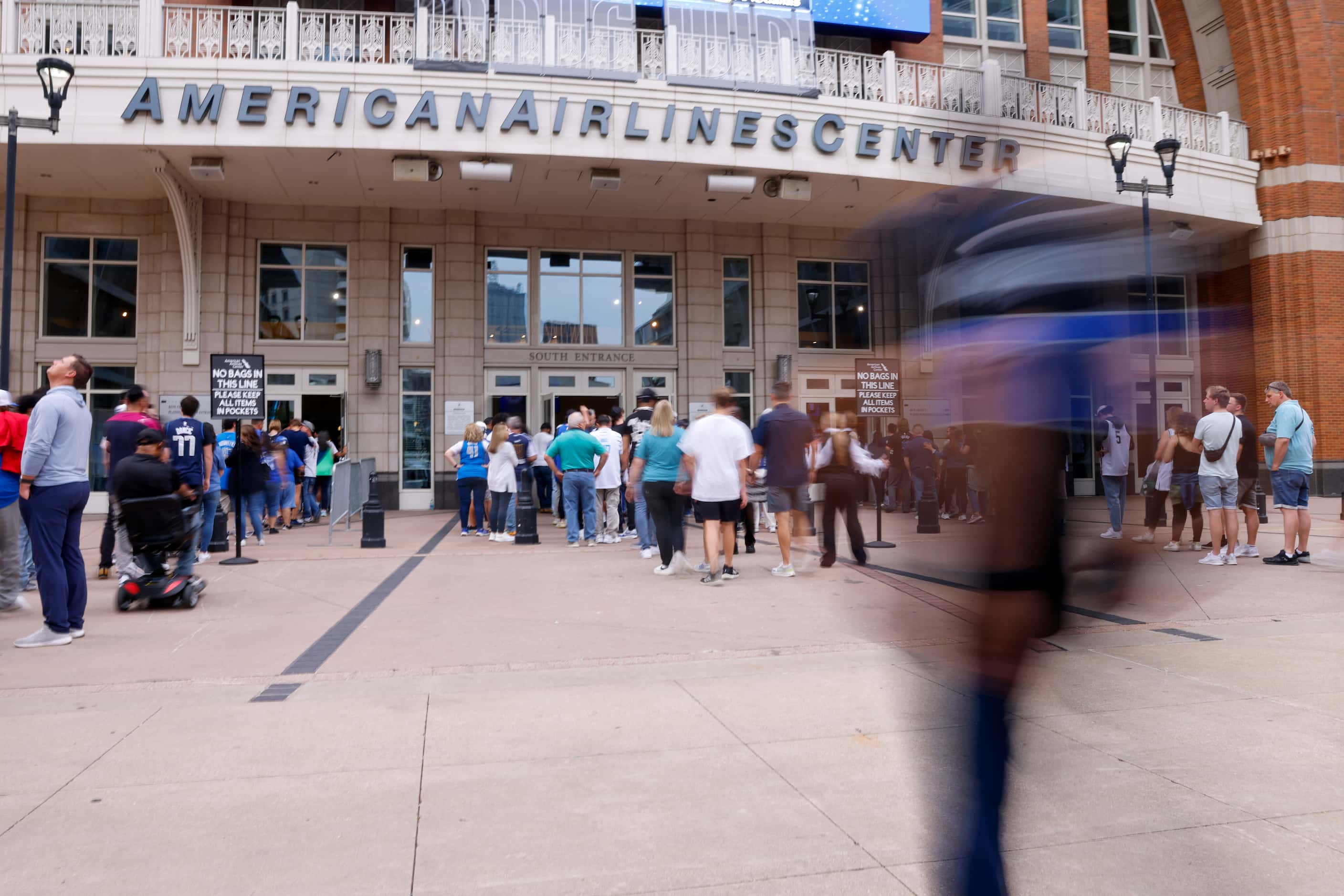 Fans enter the American Airlines Center before Game 6 of an NBA basketball first-round...