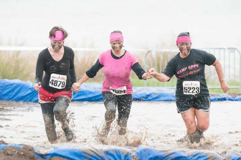 Women competing in the Dirty Girl Mud Run at Cedar Hill State Park on Saturday, Oct. 6, 2012.  