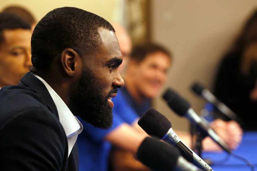 Dallas Mavericks guard Tim Hardaway Jr. (11) answers questions from the media during a press...